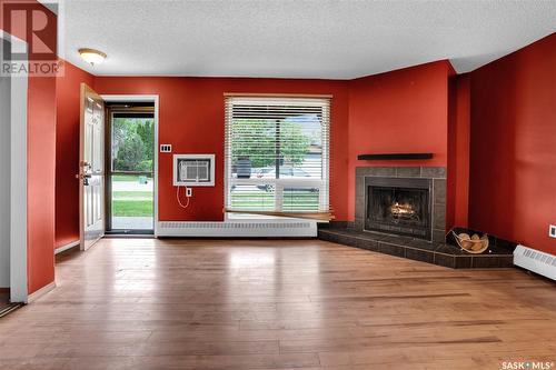 105 2911 Harding Street, Regina, SK - Indoor Photo Showing Living Room With Fireplace