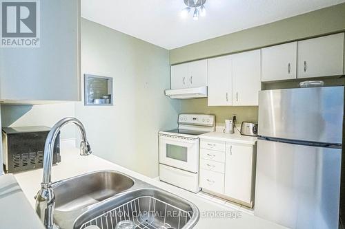 705 - 25 Grenville Street, Toronto (Bay Street Corridor), ON - Indoor Photo Showing Kitchen With Double Sink