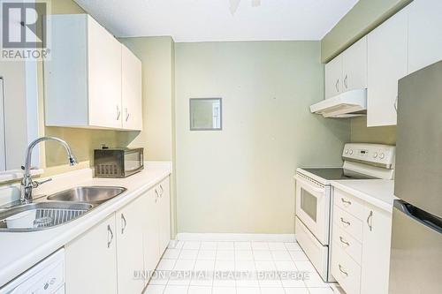 705 - 25 Grenville Street, Toronto (Bay Street Corridor), ON - Indoor Photo Showing Kitchen With Double Sink