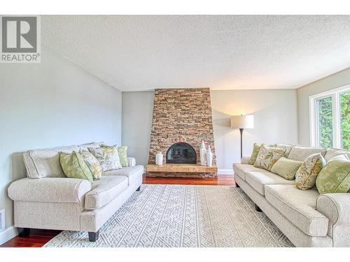 12311 Husband Road, Coldstream, BC - Indoor Photo Showing Living Room With Fireplace