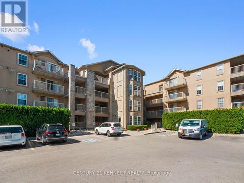 209 - 1470 Bishops Gate, Oakville (Glen Abbey), ON - Outdoor With Balcony With Facade