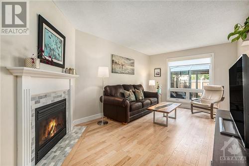 Living room with Gas Fireplace - 2029 Breezewood Street, Ottawa, ON - Indoor Photo Showing Living Room With Fireplace