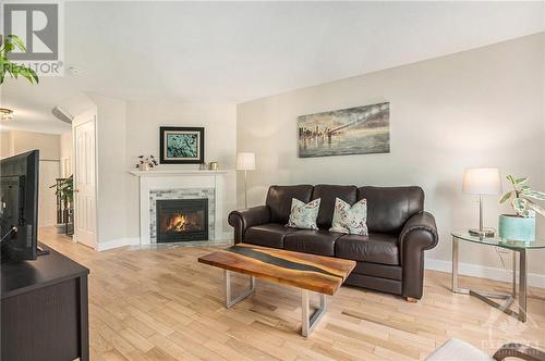 Living room with Gas Fireplace - 2029 Breezewood Street, Ottawa, ON - Indoor Photo Showing Living Room With Fireplace