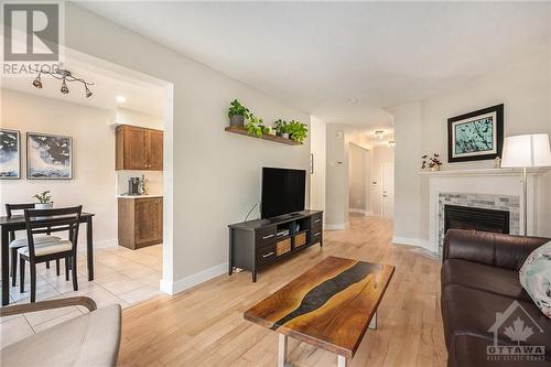 Living room with Gas Fireplace - 2029 Breezewood Street, Ottawa, ON - Indoor Photo Showing Living Room With Fireplace