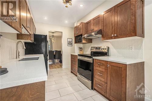 Kitchen qusrtz counter top and stainless steel appliances - 2029 Breezewood Street, Ottawa, ON - Indoor Photo Showing Kitchen