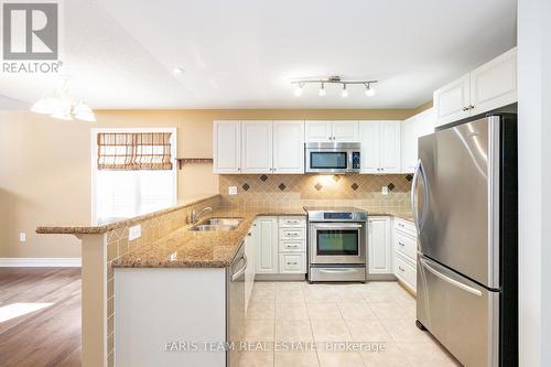 51 Tuscany Grande, New Tecumseth (Alliston), ON - Indoor Photo Showing Kitchen With Double Sink