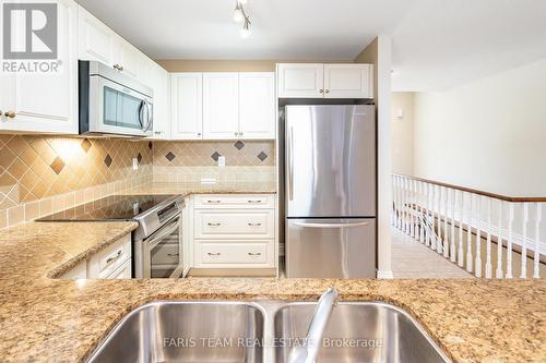 51 Tuscany Grande, New Tecumseth (Alliston), ON - Indoor Photo Showing Kitchen With Double Sink