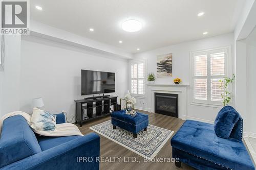 335 Bessborough Drive, Milton (Harrison), ON - Indoor Photo Showing Living Room With Fireplace