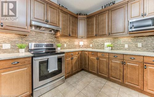 Plenty of cabinets for storage - 55 Wagon Street, Kitchener, ON - Indoor Photo Showing Kitchen