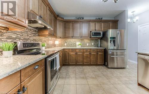 Stainless steel appliances, including newer fridge - 55 Wagon Street, Kitchener, ON - Indoor Photo Showing Kitchen