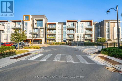 314 - 3028 Creekshore Common, Oakville, ON - Outdoor With Balcony With Facade