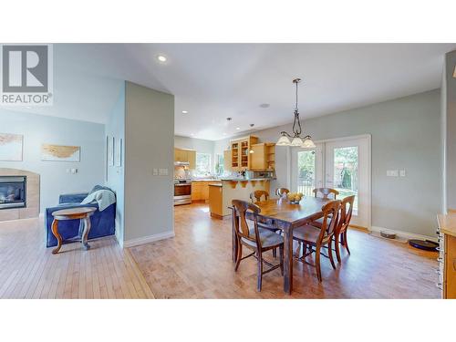 6122 Eveningstar Close, Oliver, BC - Indoor Photo Showing Dining Room With Fireplace