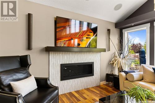 4818 Sandpiper Crescent E, Regina, SK - Indoor Photo Showing Living Room With Fireplace