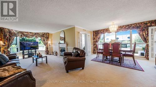 212 - 168 Bonis Avenue, Toronto (Tam O'Shanter-Sullivan), ON - Indoor Photo Showing Living Room With Fireplace