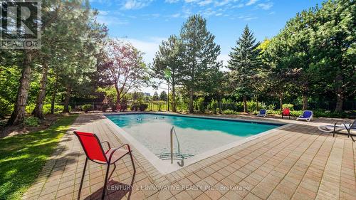 212 - 168 Bonis Avenue, Toronto (Tam O'Shanter-Sullivan), ON - Outdoor With In Ground Pool With Backyard