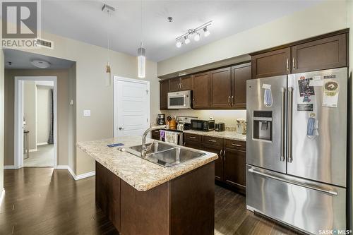 212 4501 Child Avenue, Regina, SK - Indoor Photo Showing Kitchen With Stainless Steel Kitchen With Double Sink With Upgraded Kitchen