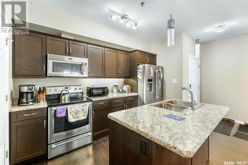 212 4501 Child Avenue, Regina, SK - Indoor Photo Showing Kitchen With Stainless Steel Kitchen With Double Sink