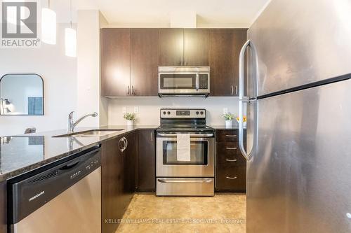 208 - 33 Whitmer Street, Milton (Scott), ON - Indoor Photo Showing Kitchen With Double Sink With Upgraded Kitchen