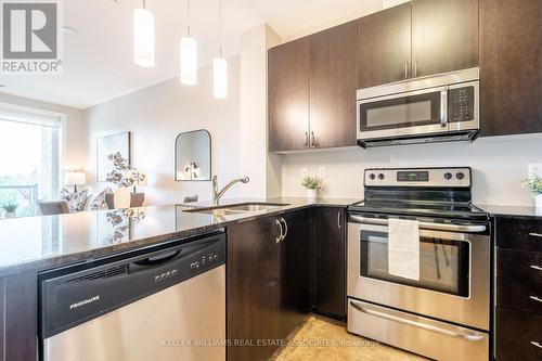 208 - 33 Whitmer Street, Milton (Scott), ON - Indoor Photo Showing Kitchen With Double Sink With Upgraded Kitchen