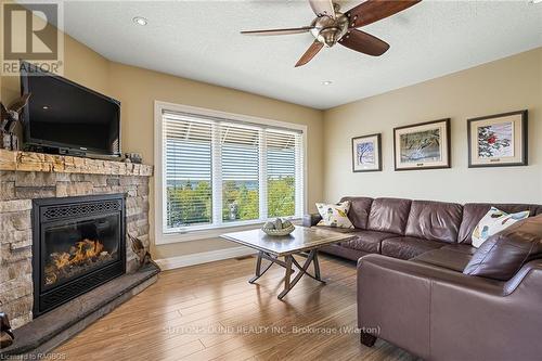 110 Sunset Boulevard, Georgian Bluffs, ON - Indoor Photo Showing Living Room With Fireplace