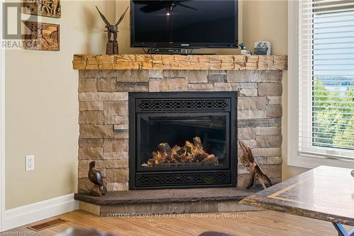 110 Sunset Boulevard, Georgian Bluffs, ON - Indoor Photo Showing Living Room With Fireplace