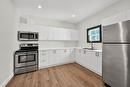 MAIN LEVEL - 68 Kinrade Avenue, Hamilton, ON  - Indoor Photo Showing Kitchen With Double Sink 