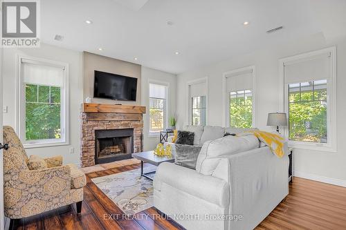 31 Marina Village Drive, Georgian Bay, ON - Indoor Photo Showing Living Room With Fireplace