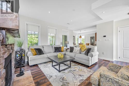 31 Marina Village Drive, Georgian Bay, ON - Indoor Photo Showing Living Room With Fireplace