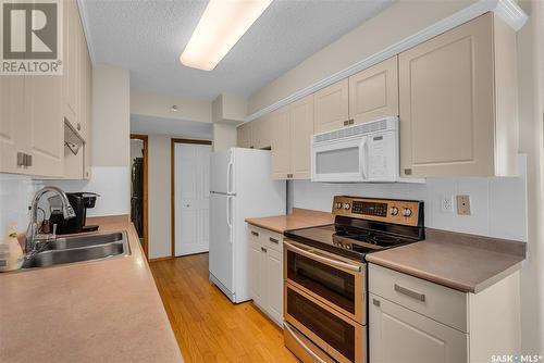 204 717 Victoria Avenue, Saskatoon, SK - Indoor Photo Showing Kitchen With Double Sink