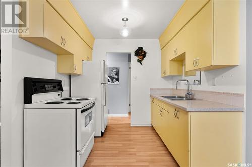 103 Magee Crescent, Regina, SK - Indoor Photo Showing Kitchen With Double Sink