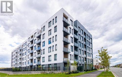 406 - 1440 Clarriage Court, Milton, ON - Outdoor With Balcony With Facade