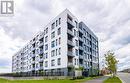 406 - 1440 Clarriage Court, Milton, ON  - Outdoor With Balcony With Facade 