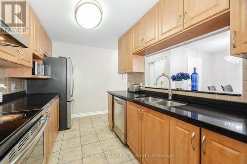 304 - 25 Trailwood Drive, Mississauga (Hurontario), ON - Indoor Photo Showing Kitchen With Double Sink