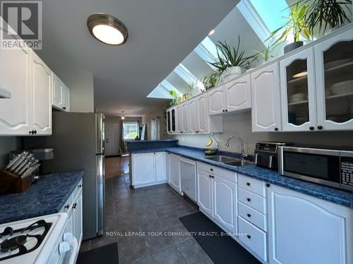 11 Della Street, Georgina (Sutton & Jackson'S Point), ON - Indoor Photo Showing Kitchen With Double Sink