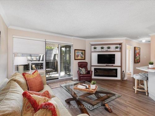 410-155 Main St N, Newmarket, ON - Indoor Photo Showing Living Room With Fireplace