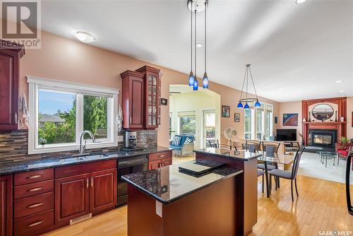 621 Brookhurst Court, Saskatoon, SK - Indoor Photo Showing Kitchen With Fireplace With Double Sink