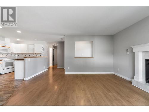 111 Harbourfront Drive Unit# 27, Salmon Arm, BC - Indoor Photo Showing Kitchen With Fireplace