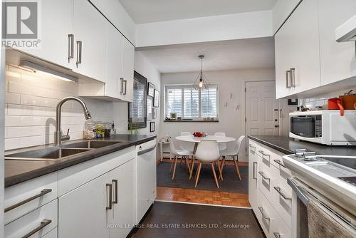 103 - 14 Norris Place, St. Catharines, ON - Indoor Photo Showing Kitchen With Double Sink