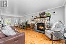 Veillard/Sargent Acreage Rm Moose Jaw 161, Moose Jaw Rm No. 161, SK  - Indoor Photo Showing Living Room With Fireplace 