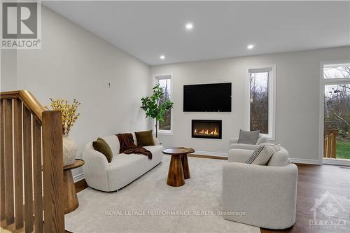 517 Paakanaak Avenue, Ottawa, ON - Indoor Photo Showing Living Room With Fireplace