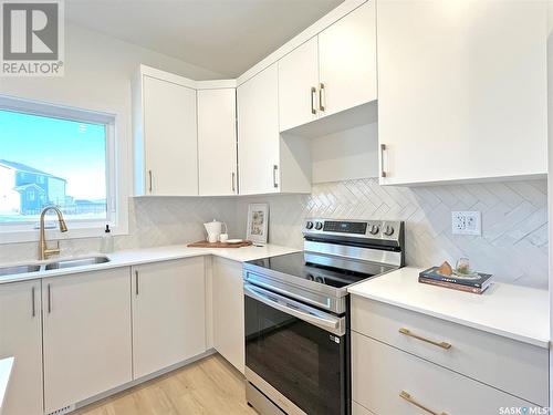 142 Taube Avenue, Saskatoon, SK - Indoor Photo Showing Kitchen With Double Sink