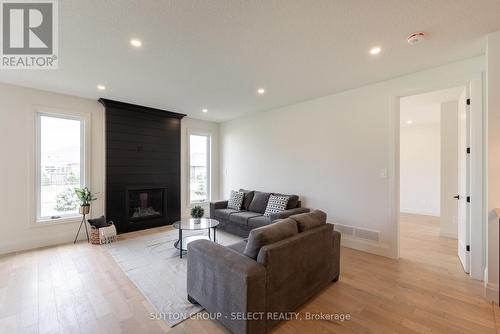 16 Kelly Drive, Zorra (Thamesford), ON - Indoor Photo Showing Living Room With Fireplace