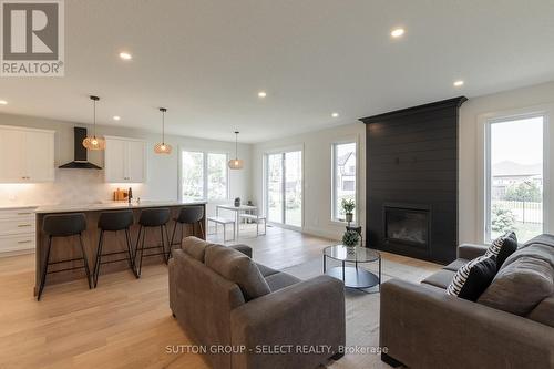 16 Kelly Drive, Zorra (Thamesford), ON - Indoor Photo Showing Living Room With Fireplace