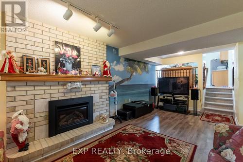 1136 Aldersbrook Road, London, ON - Indoor Photo Showing Living Room With Fireplace