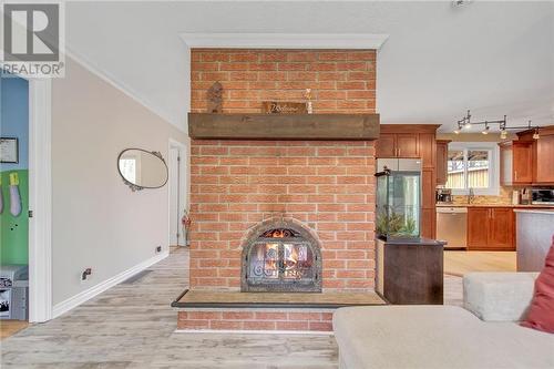 Livingroom with a cozy fireplace - 129 Spinnaker Way, Woodlawn, ON - Indoor Photo Showing Other Room With Fireplace