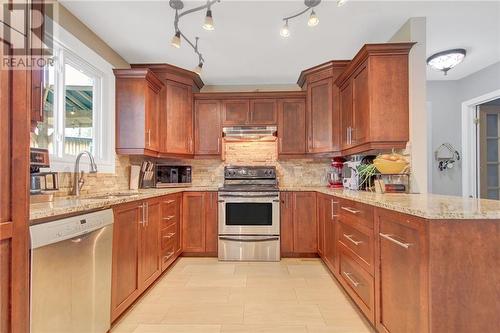 Beautiful modern kitchen with plenty of storage - 129 Spinnaker Way, Woodlawn, ON - Indoor Photo Showing Kitchen