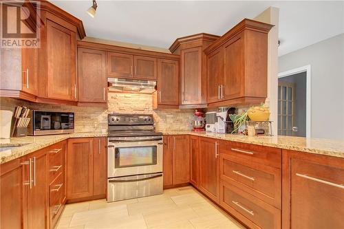 Beautiful modern kitchen with plenty of storage - 129 Spinnaker Way, Woodlawn, ON - Indoor Photo Showing Kitchen