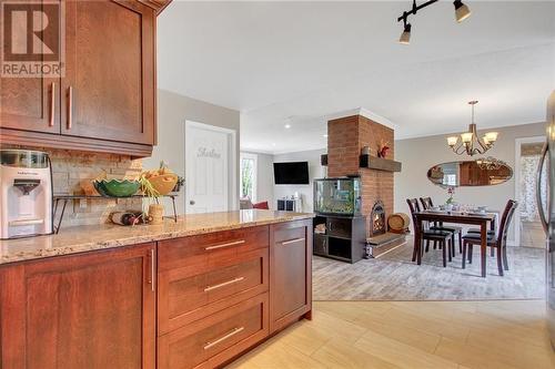 Open concept into the dining and living room - 129 Spinnaker Way, Woodlawn, ON - Indoor Photo Showing Kitchen