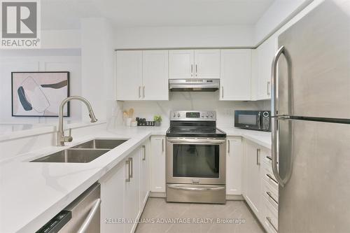 207 - 1 Emerald Lane, Vaughan, ON - Indoor Photo Showing Kitchen With Stainless Steel Kitchen With Double Sink With Upgraded Kitchen