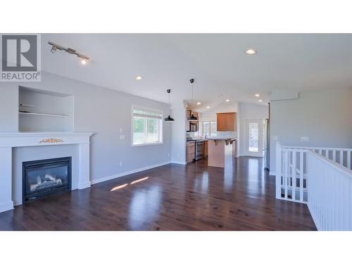 4891 Warbler Court, Kelowna, BC - Indoor Photo Showing Living Room With Fireplace